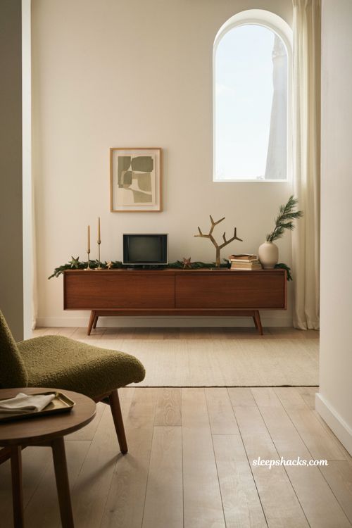 mid century modern christmas decor ideas for living room tv console with minimalist garland