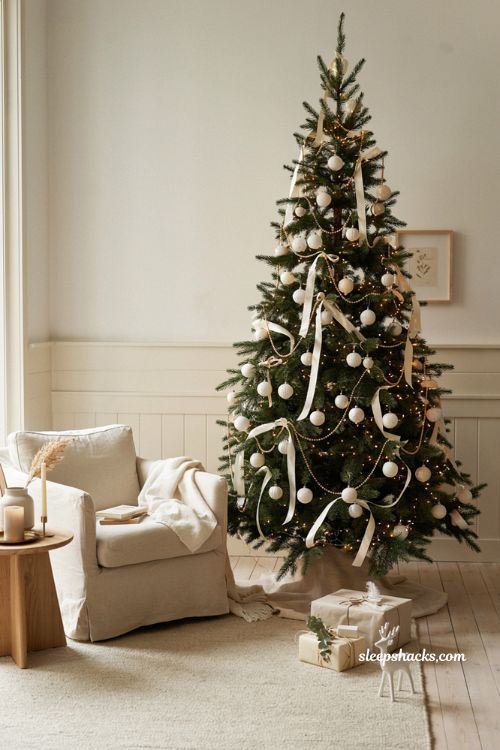 minimalist elegant christmas tree decor ideas with white ornaments gold beads and cozy living room style