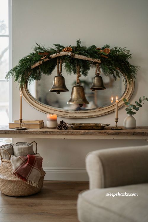 oversized bell christmas garland decor ideas with brass bells and greenery for a cozy living room