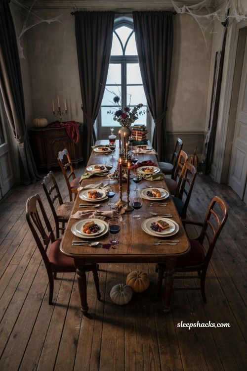 Abandoned Halloween dinner table with candles and gothic storytelling decor
