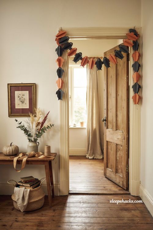 Accordion fold Halloween paper garland DIY with connected ghosts and pumpkins