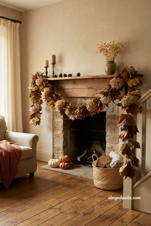 Autumn leaf garland with dried hydrangeas pinecones and cozy fall mantel decor