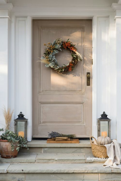 Autumn wreaths for a front door with lambs ear eucalyptus and orange berry wreath