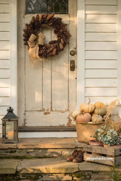 Autumn wreaths for a front door with rustic pinecone wreath and burlap bow