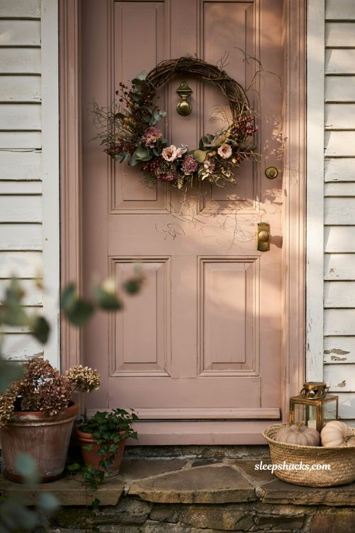 Autumn wreaths for a front door with wispy oval grapevine wreath and romantic fall florals