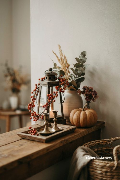 Berry garland wrapped lantern boho fall decor with rust berries raffia pumpkin and dried florals