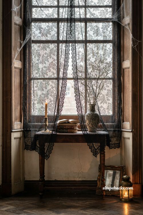 Black lace curtains for creepy gothic Halloween room decor 