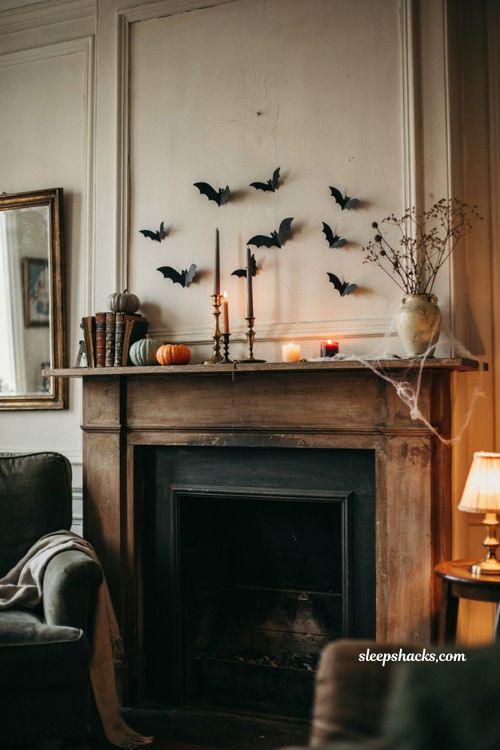 Black paper bats on a mantel for elegant Halloween living room decor