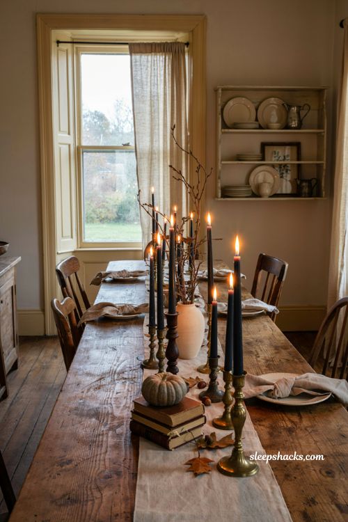 Black taper candles with vintage candlesticks for farmhouse Halloween decor 