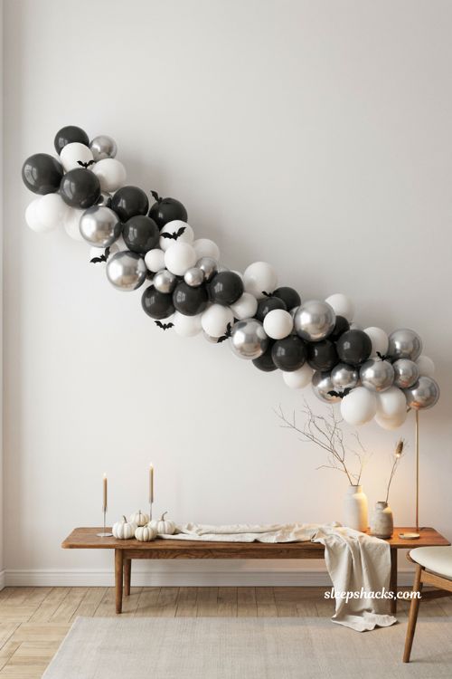 Black white and silver Halloween balloon garland with bat balloons and modern minimalist party decor
