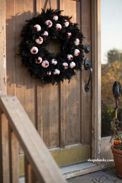 Bloodshot eyeball wreath black feathers creepy Halloween front door decor
