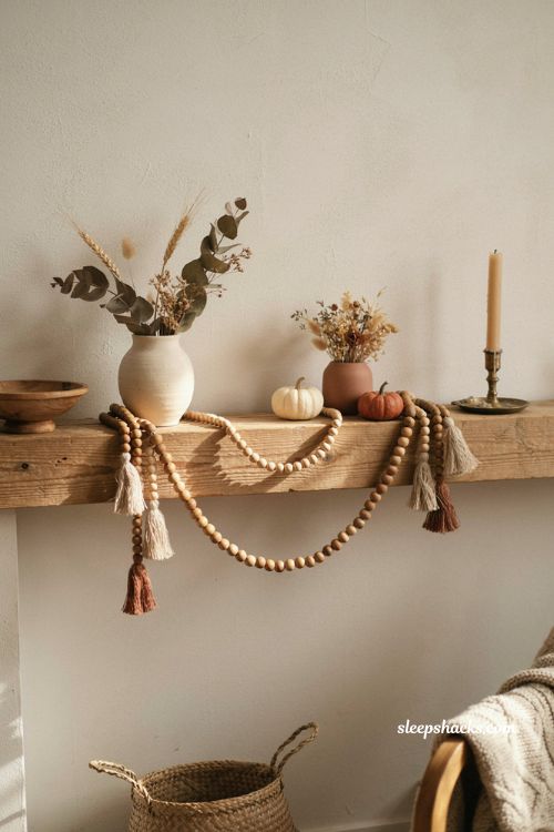 Boho fall mantel decor with tassel and wood bead garland dried florals and natural textures
