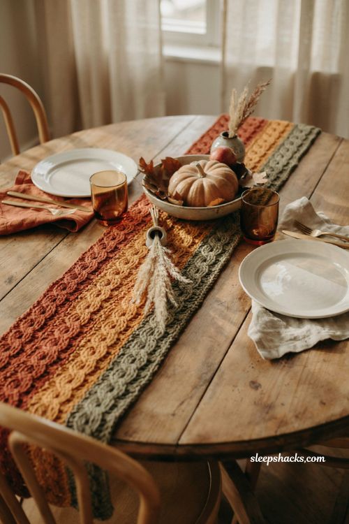 Braided autumn crochet table runner with terracotta mustard and olive yarn diagonal round table and cozy fall decor 