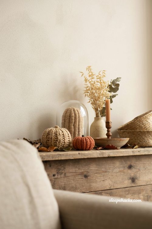 Braided raffia and jute pumpkins boho fall mantel decor with natural textures and glass cloche