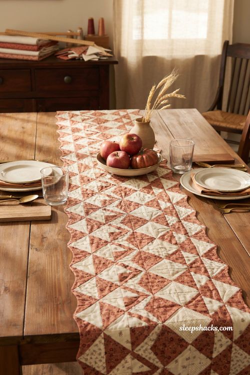 Broken dishes fall table runner with vintage quilted triangles in rust cream and tan farmhouse dining table