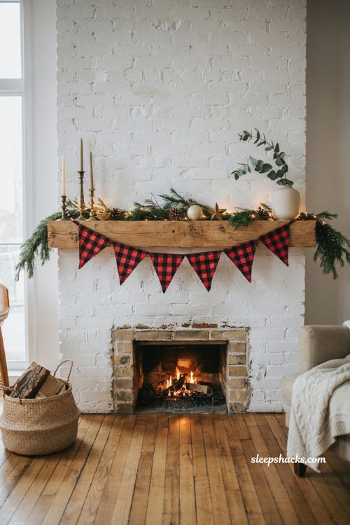 Buffalo check Christmas banner above farmhouse fireplace mantel decor