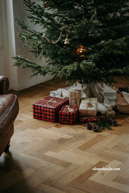 Buffalo plaid Christmas gift wrapping ideas under a cozy farmhouse tree