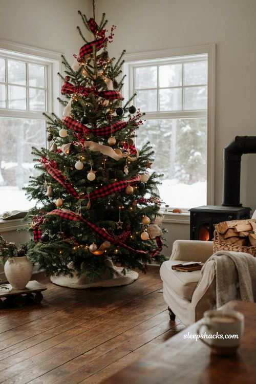 Buffalo plaid Christmas tree with cozy farmhouse ribbon and rustic decor