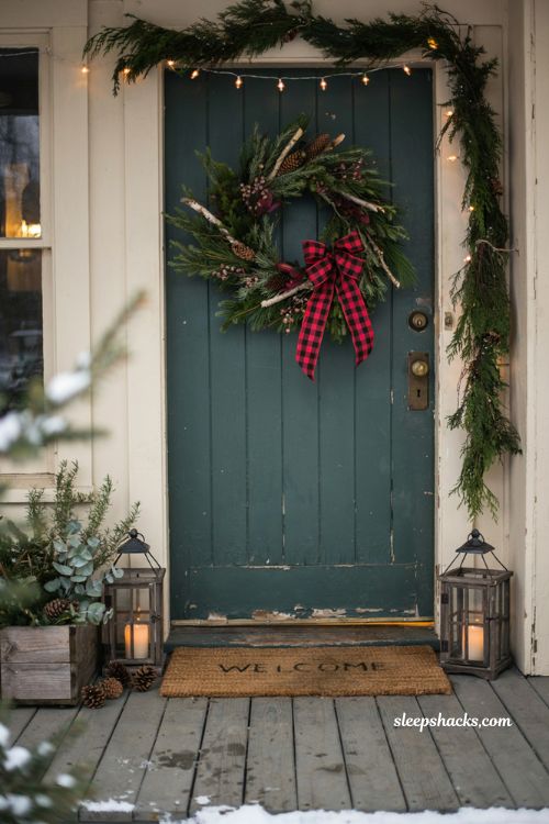 Buffalo plaid Christmas wreath with red flowers and farmhouse front door decor