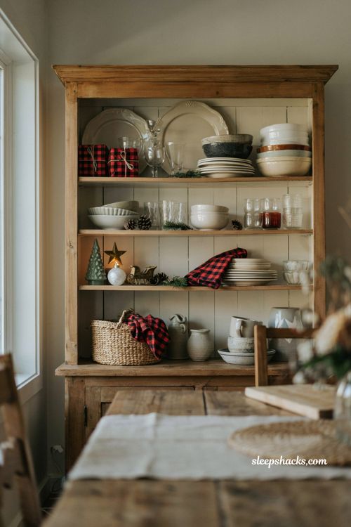 Buffalo plaid accents on farmhouse hutch for cozy Christmas decor