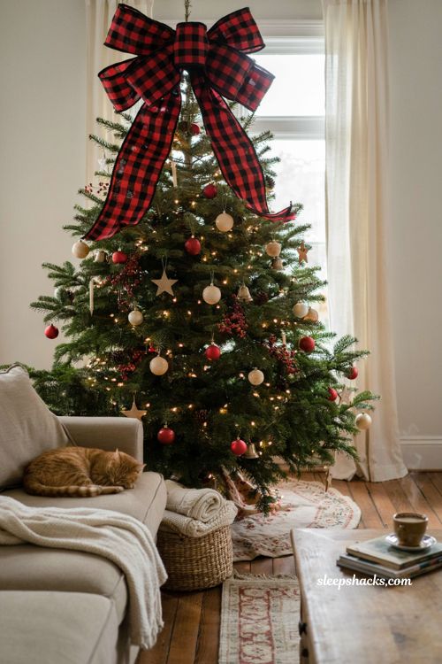 Buffalo plaid bow Christmas tree topper for a cozy farmhouse tree