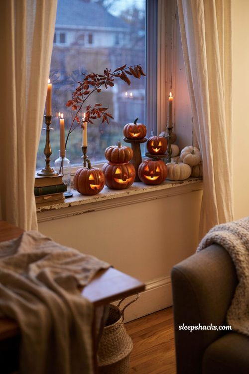 Carved pumpkin display glowing on a windowsill for classic Halloween decor