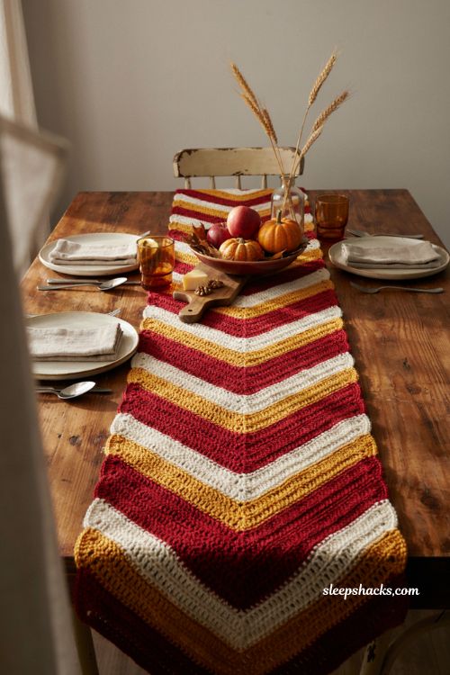 Chevron fall crochet table runner with deep red gold and cream zigzag crochet pattern cozy autumn farmhouse dining table 