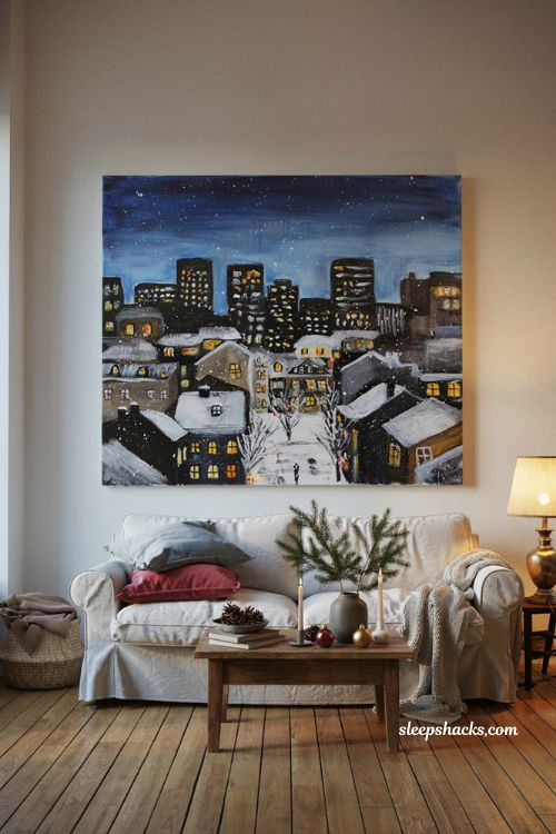 Christmas city skyline painting on canvas with snowy buildings and glowing windows