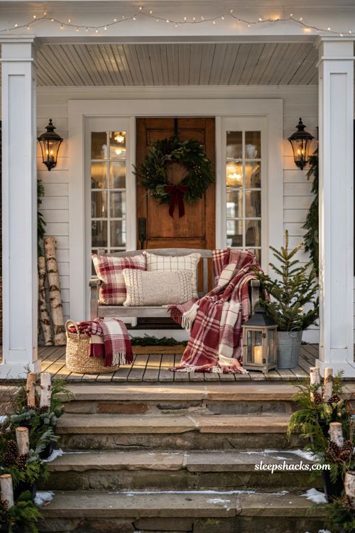 Christmas front porch bench with plaid blankets and cozy holiday pillows