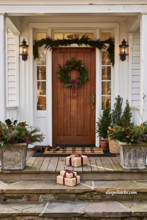 Christmas front porch with layered seasonal doormat and cozy holiday entryway