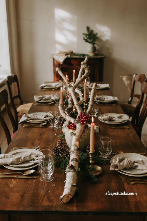Christmas tablescape with birch branch centerpiece string lights and red berries