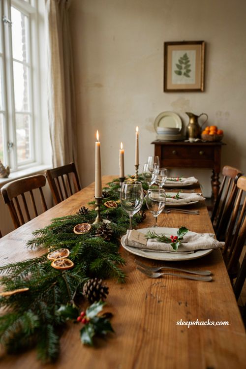 Christmas tablescape with handwritten place cards rosemary sprigs and holly