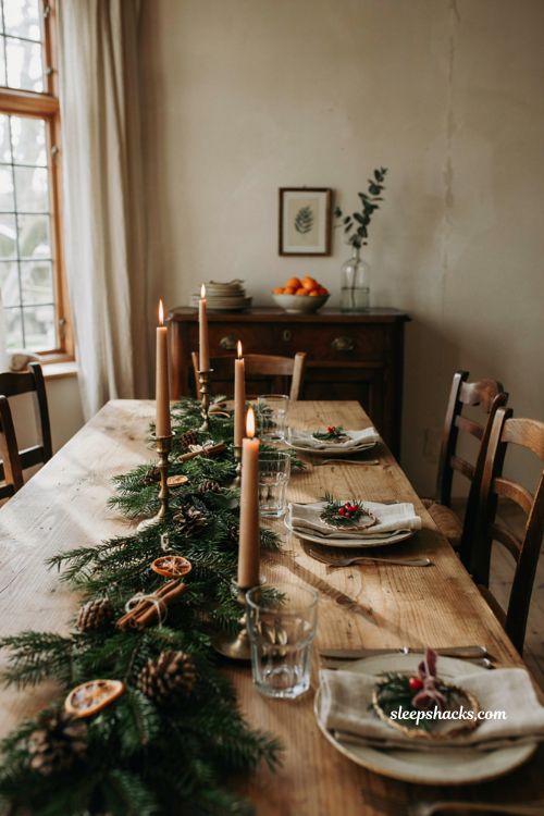 Christmas tablescape with mini wreath napkin rings greenery and red berries