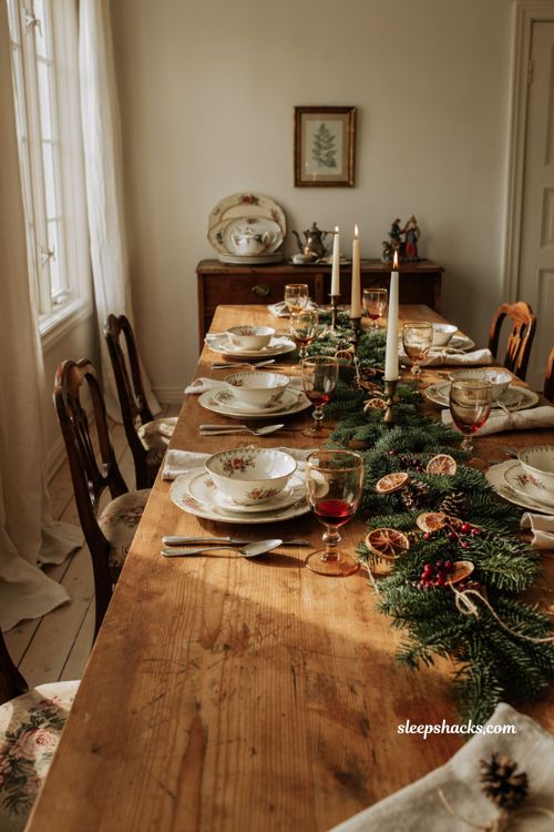 Christmas tablescape with mismatched vintage china floral plates and antique gold rims
