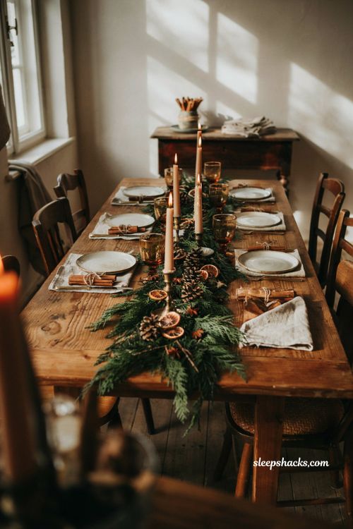 Christmas tablescape with pinecones cinnamon sticks star anise and evergreen decor
