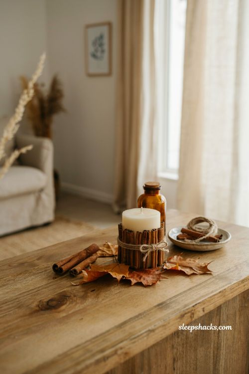 Cinnamon stick wrapped candles for cozy fall decor