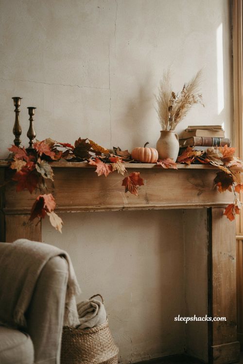 Classic faux fall leaf garland on a cozy farmhouse mantel