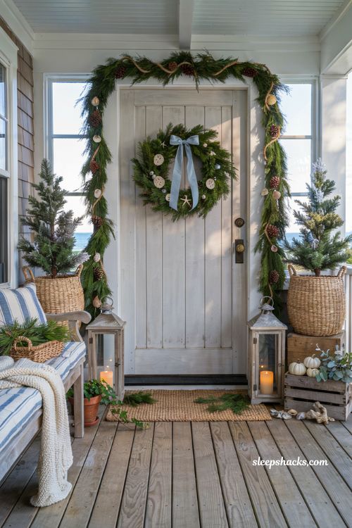 Coastal christmas porch decor ideas with blue and white holiday decorations on a cozy seaside front porch