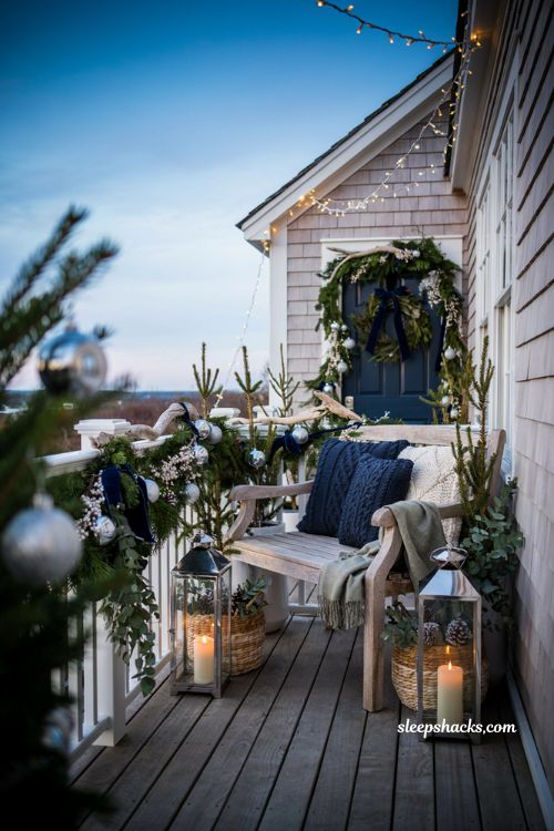 Coastal christmas porch decor ideas with blue white and silver holiday palette