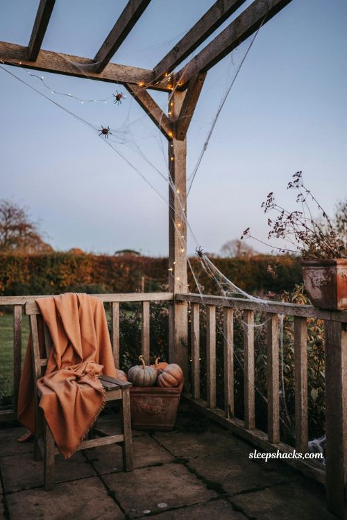 Cobweb draping with fairy lights for patio halloween decorating