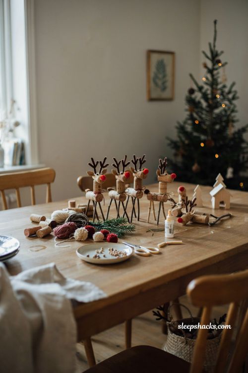 Cork reindeer Christmas ornaments craft for kids with twigs pipe cleaners and pom poms