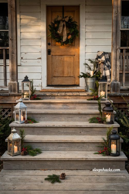 Country christmas porch steps lined with rustic lanterns and farmhouse holiday decor