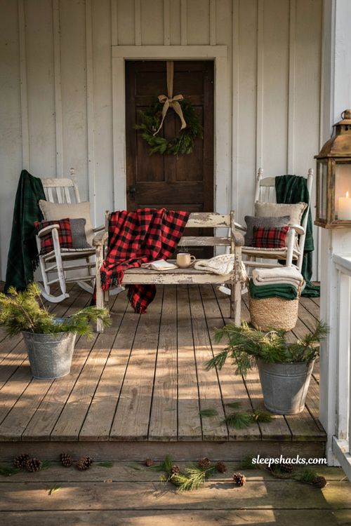 Country christmas porch with plaid blankets on rocking chairs and farmhouse seating