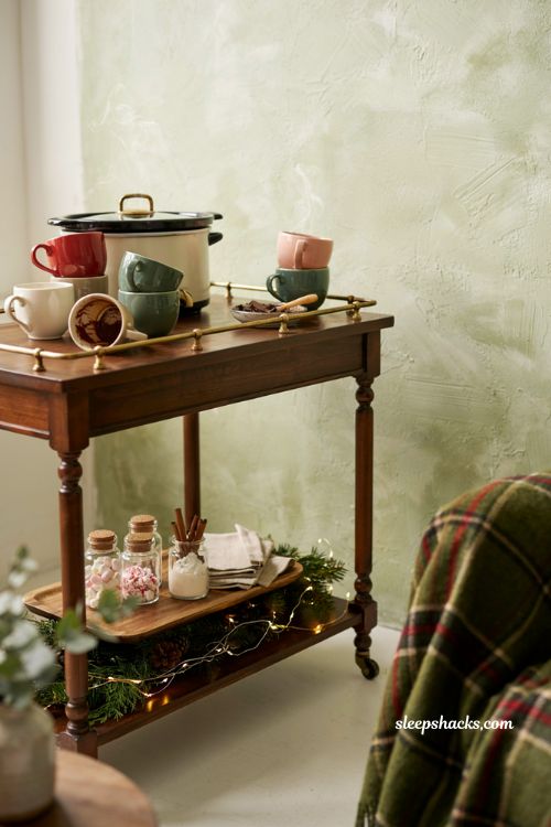 Cozy DIY hot cocoa station idea on a vintage bar cart for holiday entertaining and christmas parties