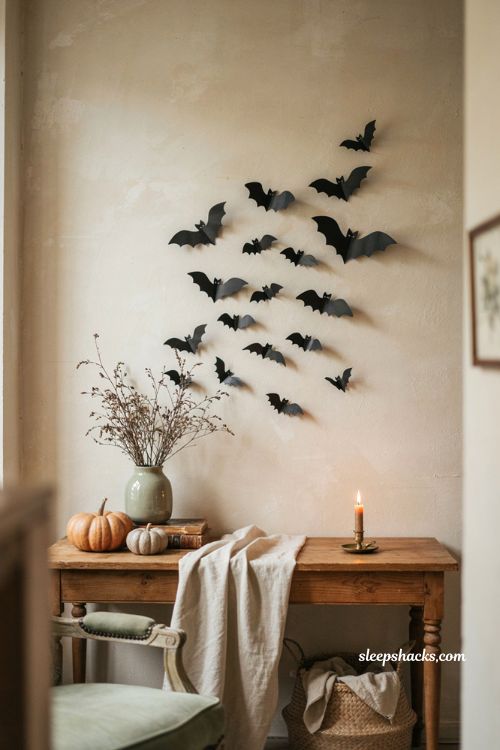 Cozy Halloween decor with chic black paper bats flying across a living room wall 