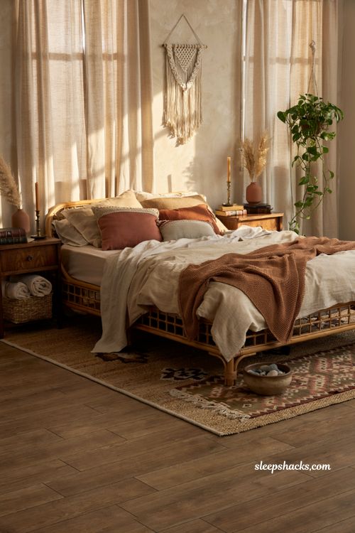 Cozy bohemian bedroom with chunky knit throw blanket and layered bedding