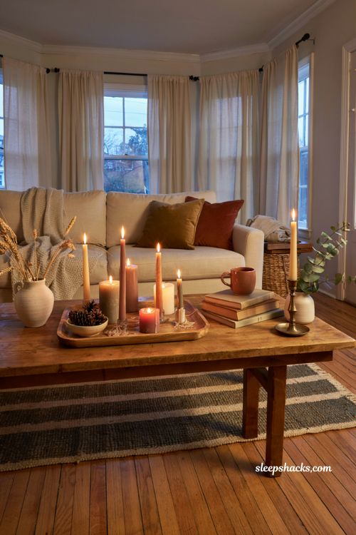 Cozy fall candle styling ideas with grouped pillar candles and warm evening decor