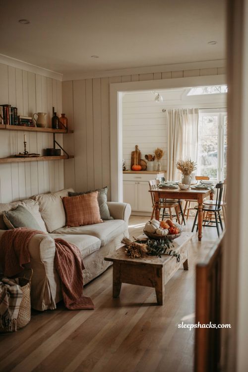 Cozy fall room decor ideas with farmhouse textures pumpkins and warm autumn accents