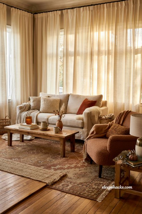 Cozy fall seating ideas with layered throws knit pillows and warm textures