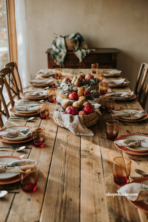 Cozy rustic fall baby shower centerpiece idea with harvest fruit baskets pears apples pomegranates and linen